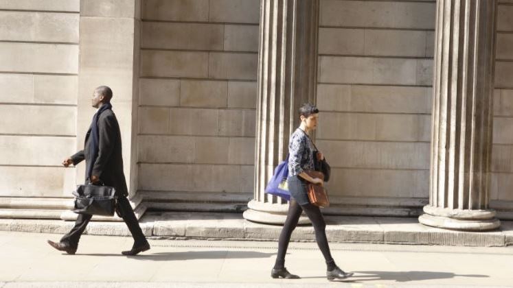 Two financial workers walking