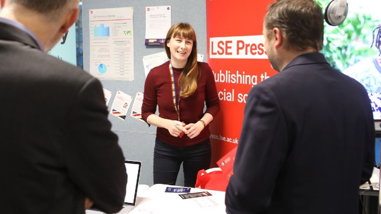 Lucy Lambe, Scholarly Communications Officer, at the LSE Press stand at the LSE Research Showcase.