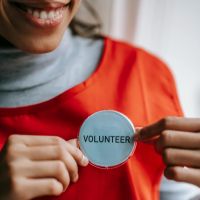 person with volunteer badge image sourced licence free from pexels 200x200