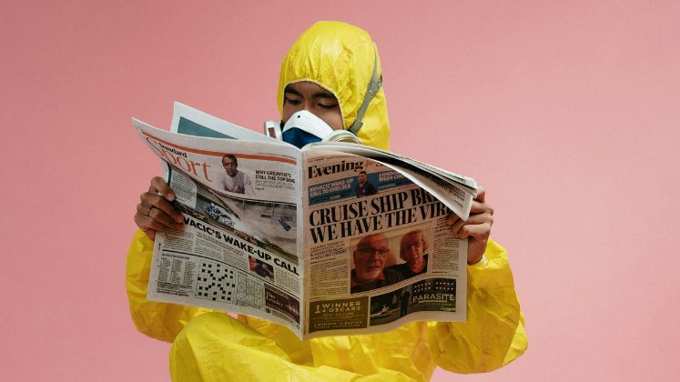 747x420_Fake_news_image_man_in_yellow_overalls_reading_paper_from_pexels
