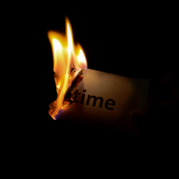 Burning_paper_with_the_word_time_stock_image_from_Canva