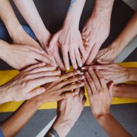 Group_of_hands_together_stock_image_from_Canva
