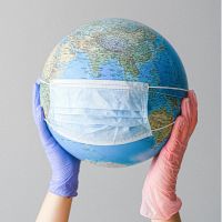 gloved hands holding globe image sourced licence free from pexels