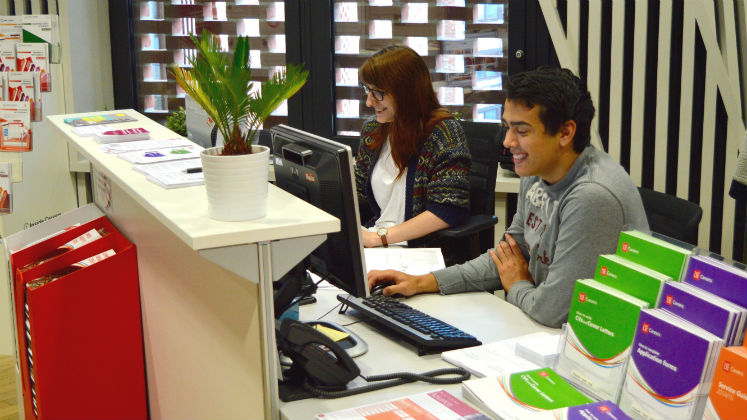 Two employees at a reception desk | LSE careers and services