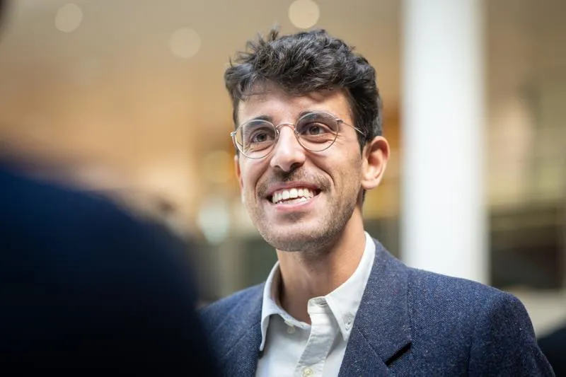 Man in conversation smiling Leading Organisational Culture