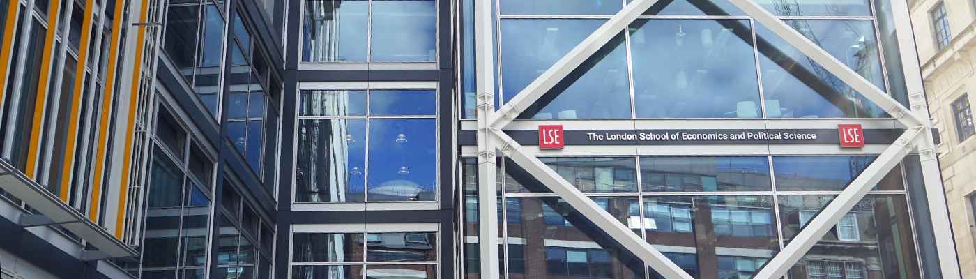 Abstract photograph of the LSE Government building with clouds reflected in the glass architecture.