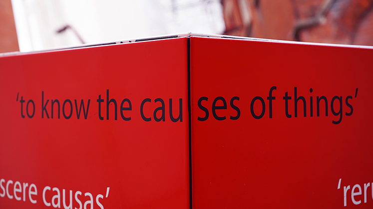 Abstract photo of the LSE motto 'to know the causes of things' on the LSE campus.