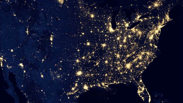 A night shot of the USA from space showing light pollution (or not) with the brightest and tightest areas of light on the east coast.