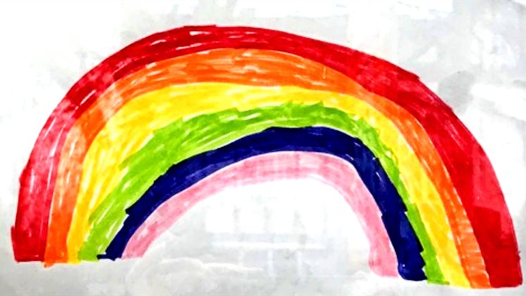 A child's hand-drawn rainbow