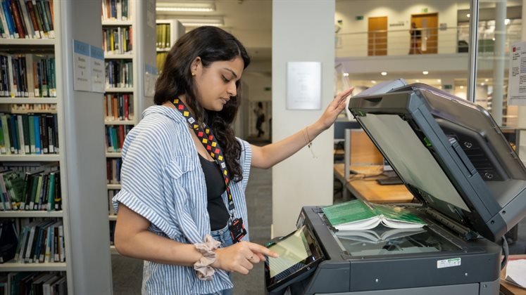 A person using a photocopier