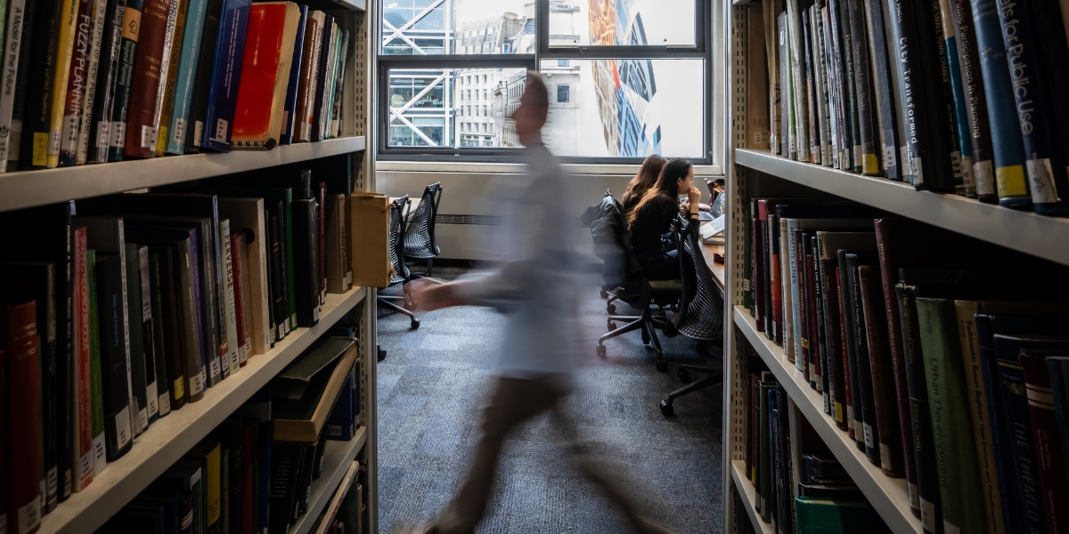 A view down the stacks as someone walks past