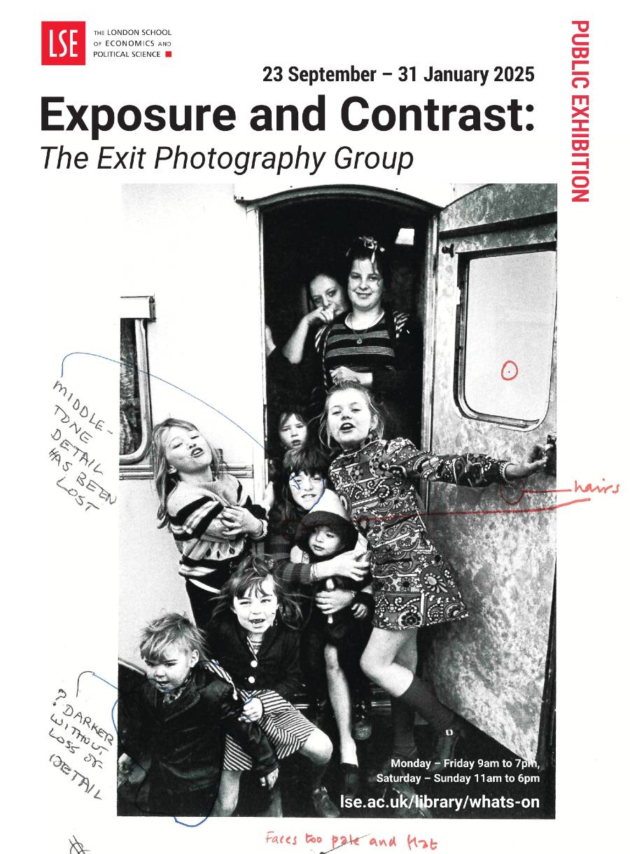 A poster with exhibition details on and a photo of children at the doorway of a caravan with adults looking on.