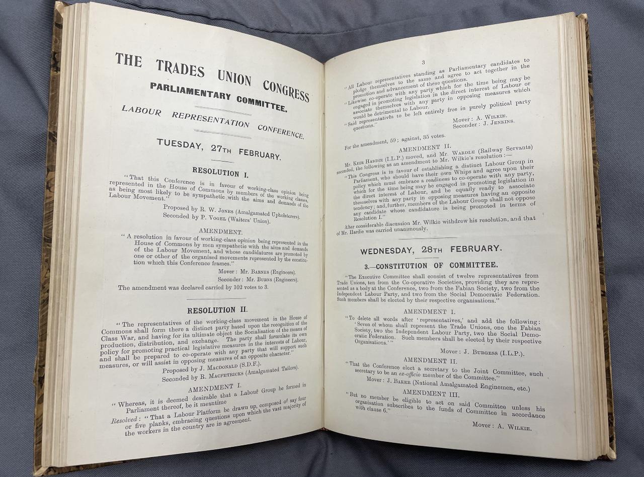 A Trades Union Congress conference programme open to show a set of resolutions.