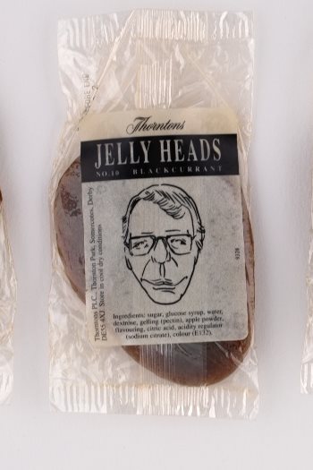 A 'jelly head' sweet in a wrapper. The sweet depicts John Major.