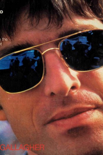 A close up of Noel Gallagher who is wearing sunglasses
