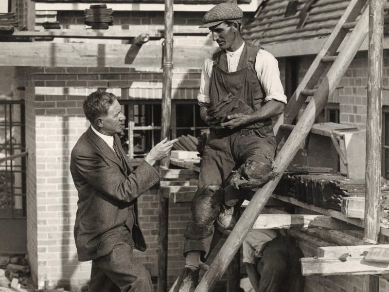 Walter Citrine talking to a tiler working on Tolpuddle Cottages, 1934 800x600