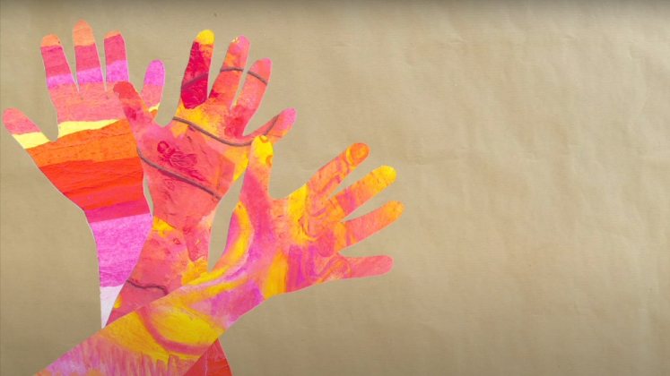 An image of orange, pink, yellow and red hand artworks that represent sunbeams