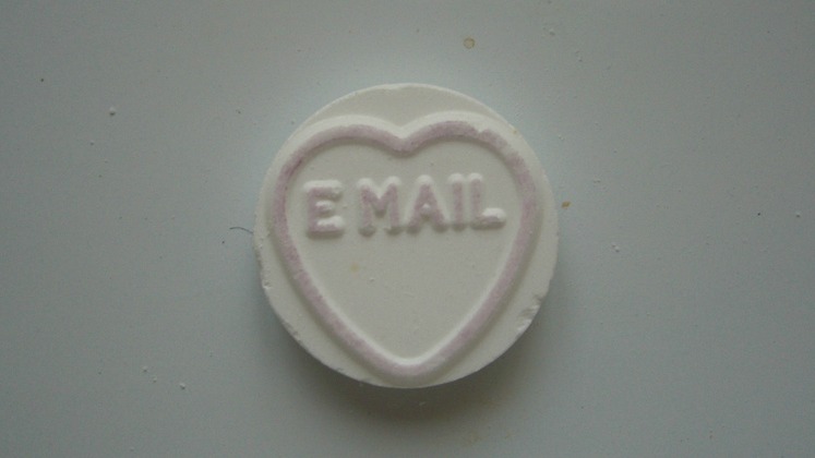 A small candy with the word "email" on it
